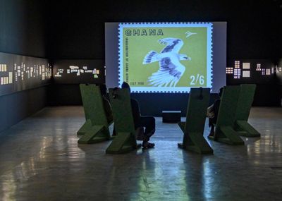 The Otolith Group, In the Year of the Quiet Sun (2013). 16:9 H.D. video installation with colour and sound, digital scans, archival film, projection wall, seating. 33 min, 57 sec. Exhibition view: Xenogenesis, Sharjah Art Foundation (13 November 2021–6 February 2022).