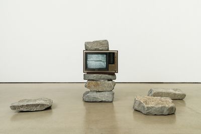 Park Hyunki, Untitled (TV Stone Tower) (1982). Colour video (silent), CRT monitor, and stones. Dimensions variable. © Park Sungwoo.