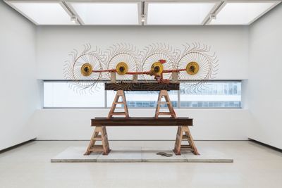 Mike Nelson, The Asset Strippers (solstice) (2019). Hay rake, steel trestles, steel girders, sheet of steel, and cast concrete slabs. Exhibition view: Extinction Beckons, the Hayward Gallery, London (22 February–7 May 2023).