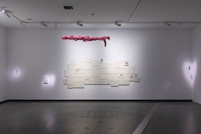Mithu Sen, Until you 206 (2021–2022). Zarina, metallic paper, watercolour ink, eco-anxiety, violence, mass graves, and lynching tools on acid-free handmade paper. Set of 56 'Happy Prick' drawings framed. 213 x 457 cm (overall). Exhibition view: mOTHERTONGUE, Australian Centre for Contemporary Art, Melbourne (22 April–18 June 2023).