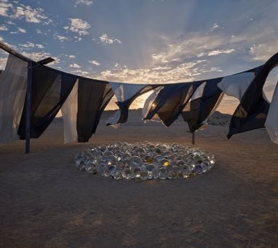 Olafur Eliasson, Your pearl garden (2023). Galvanised steel, textile (white, anthracite), solar lamp, glass spheres (various sizes), silver, paint (black, yellow). 380 x 950 x 950 cm. Exhibition view: The curious desert, near the Al Thakhira Mangrove in Northern Qatar (19 March–15 August 2023).