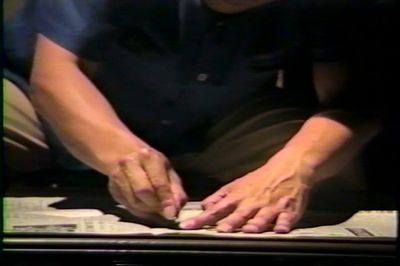 Sung Neung Kyung, Reading Newspaper (still). Performance view: Cheongpa Theater, Seoul (1988). Organised by Yoon Jin Sup.