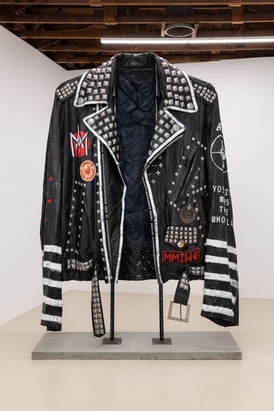 Ishi Glinsky, Coral vs. King Snake Jacket (2019). Canvas, industrial adhesives, wax, wood beads, aluminium, steel, nylon, enamel paint, black pigment. 120 x 96 x 35 inches (with stand).