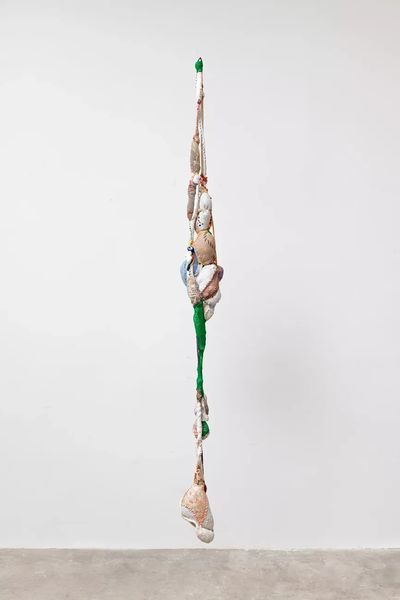 Sonia Gomes, Untitled (Pendente series) | Sem título (série Pendente) (2023). Stitching and bindings, various fabrics and ropes, laces, beads, and buttons. 260.1 x 26.9 x 25.1 cm.
