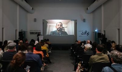 Mosab Abu Toha reading a selection of poetry in 'Poems Under the Rubble' session at March Meeting, Sharjah Art Foundation (1–3 March 2024).