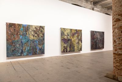 Nour Jaouda, Roots in the sky; If the Olive trees knew...; Silent Dust (all 2023). Hand-dyed textile, steel. 250 × 300 cm each. Exhibition view: Stranieri Ovunque – Foreigners Everywhere