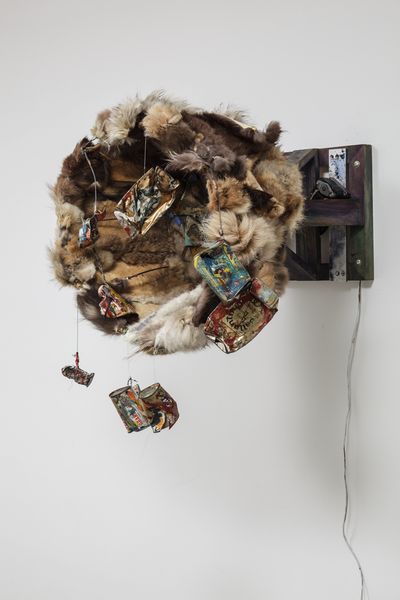 Carolee Schneemann, Fur Wheel (1962). Lampshade base, fur, tin cans, mirrors, glass, and oil paint mounted on turning wheel. 48.5 x 48.5 x 29.3 cm.