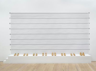 Gary Simmons, Lineup (1993). Screen print with gold-plated basketball shoes. 114 × 216 × 18 in. Collection Whitney Museum of American Art, New York; purchase, with funds from the Brown Foundation, Inc., 93.65a-p. © Gary Simmons. Photo: Ron Amstutz.