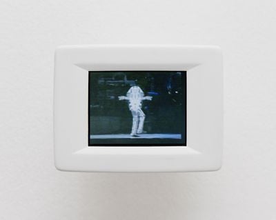 Paul Pfeiffer, Live Evil (Amsterdam) (2018). Digital video loop, 2 min, 5 sec. LCD screen in custom 3D printed, painted, resin shell, media player. 7 x 9 cm.