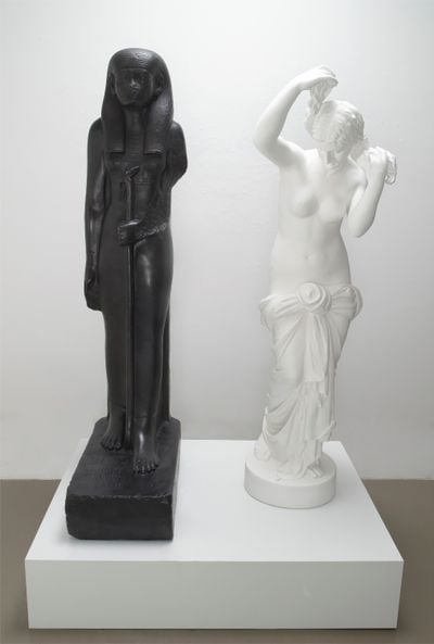 Fred Wilson, The Mete of the Muse (2006). Bronze with black patina and bronze with white paint. African figure: 165.1 x 66 x 35.6 cm; European figure: 154.9 x 45.7 x 50.8 cm. Edition of 5 + 2AP.