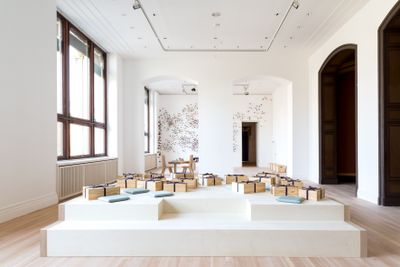 Lee Mingwei, Fabric of Memory (2006/2020). Wooden platform, wooden boxes, fabric items. 485 x 485 x 65 cm. Exhibition view: Lee Mingwei: 禮 Li, Gifts and Rituals, Gropius Bau, Berlin (27 March–12 July 2020).