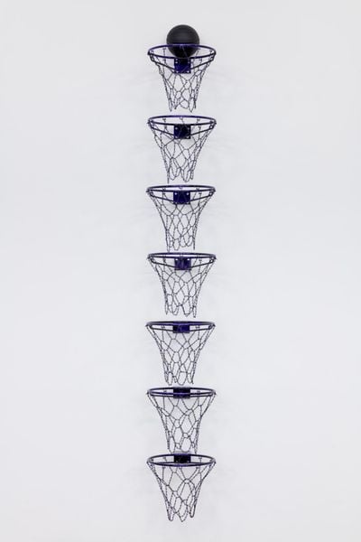 Awol Erizku, Oh, What a Feeling, Fuck it, I Want a Billion (Purple) (2018). Mixed media with seven regulation size basketball rims and Spalding NBA basketball. Edition of 1 + 1 AP. 376 x 48 x 62 cm. Courtsy the artist and Ben Brown Fine Arts.