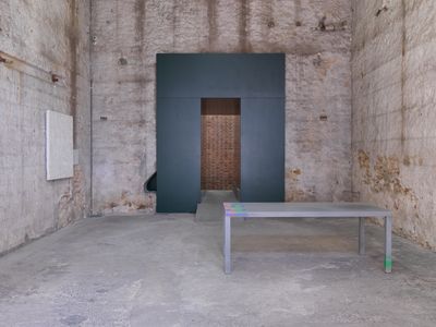 A table stands in the empty gallery space of Rodeo in Athens.