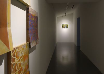 Left to right: Ian Woo, 'Flag – Installation' (2019); Donna Ong, 'My Forest Has No Name' (2014–ongoing). Exhibition view: The Lie of the Land, FOST Gallery, Singapore (7 August–17 October 2021).
