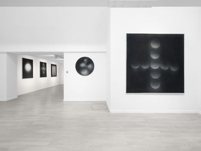 A series of black and white geometric works by Marco Tirelli line the white walls of Cardi Gallery in London.