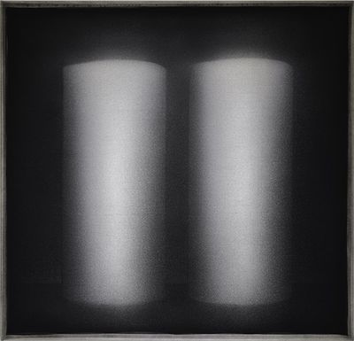 Two cylindrical forms appear from a black background.