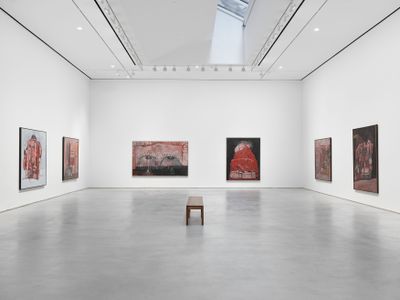 Large canvases by Philip Guston line the walls of a bright, white exhibition space.