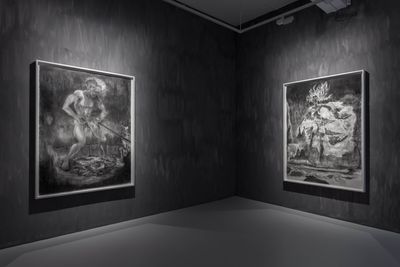 Two large-scale drawings in black and white by Sedrick Chisom are placed upon grey walls in the gallery space.