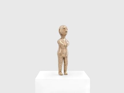 A Brazilian ex-voto figurine recreated by Sherrie Levine stands atop a pedestal in a white gallery space.