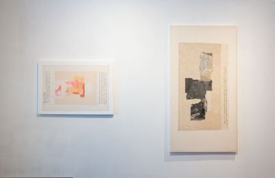 Two collages of paper fragments overlaid on beige Xuan paper, one in peach tones and the other black and white, are placed side by side on a white gallery wall.