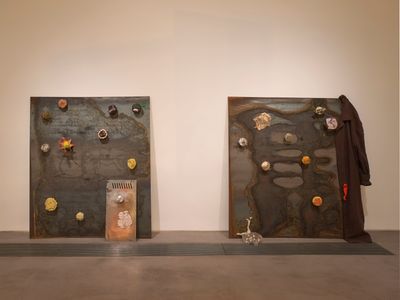 Lou Lou Sainsbury and Kari Leigh Rosenfeld, i keep you in my gut i keep you in my throat—are you hungry? i can feel you beating in me i can (2022). Wax, epoxy resin, clay, soil, spray paint, gummies, quail eggs, apple core, sugar, tree bark, lichen, popcorn, plasticine, make up, jacket, crochet, steel plates. Three plates; 125 x 109 x 10 cm each. Exhibition view: Earth is a Deadname, Gasworks, London (7 July–18 September 2022). Commissioned and produced by Gasworks.