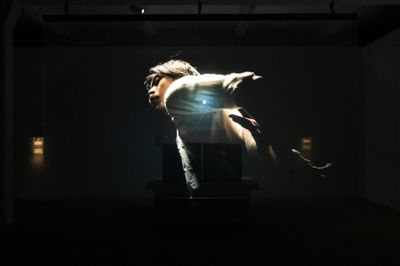 Leung Tin Chak performance in Against Step (2019). Video installation. HD video projection, colour, sound. 14'; 8 C.R.T. T.V. videos, variable lengths, colour, 1'05′′ to 4'01′′. Exhibition view: emo gym, Tai Kwun Contemporary, Hong Kong (21 April–19 June 2022).