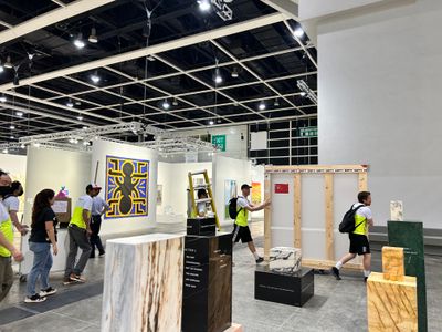 Galleries restock their booths at the end of the first day at Art Basel Hong Kong 2023. Photo: Shanyu Zhong.