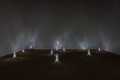 Edson Luli, Footsteps Towards the Future (2023). Protocol, desert sand from five continents, plastic bottles, LED lights, transformers. Variable dimensions.
