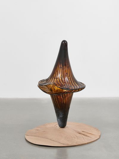 Marguerite Humeau, The Brewer (2023). Handblown glass, 150-year-old walnut (cause of death: unknown), Bermondsey Street Bees raw honey, 4,500-year-old yeast, brewer's yeast, wasp venom and culture of termite mushroom (Termitomyces). © Marguerite Humeau.