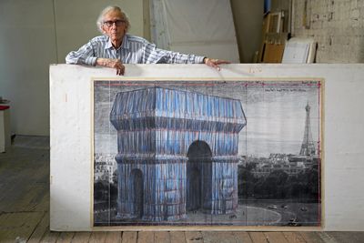 Christo in his studio with a preparatory drawing for "L'Arc de Triomphe, Wrapped". Photo Wolfgang Volz, New York City, September 20, 2019.