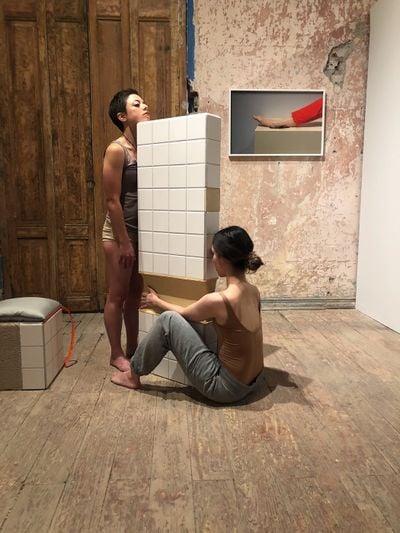 Melanie McLain, Wall Compressions (2020). Ceramic tile, wood, silicone, fabric, high density foam, plaster and zippers. 53 x 14 x 32 in. Image
