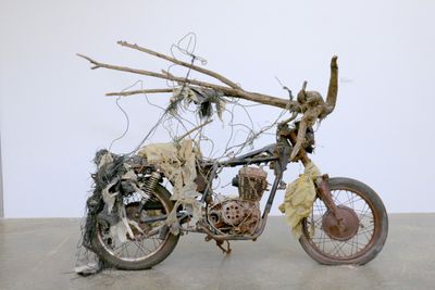 Lonnie Holley, Riding Through My Roots Too Fast (2004). Old motorcycle frame, tarp, fabric, wood, wire. 66 x 84 x 26 inches.