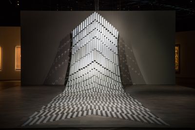 Mataaho Collective, Kaokao (2014). Hi-vis reflective cloth tape and cotton. 1,200 x 220 cm.