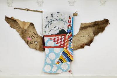 Natalie Ball, Bang Bang (2019). Elk hide, wood, rope, rabbit fur, paint, and textiles. 84 x 124 inches.