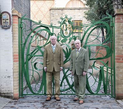 Gilbert & George stand in front of the Gilbert & George Centre, 5a Heneage Street, Spitalfields, London, E1 5LJ.