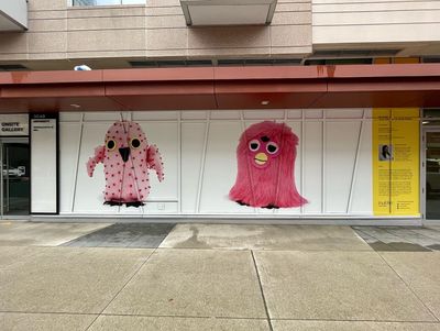 Kablusiak Carpenter, Up Front: Plucked Ookpik and Furby Ookpik (2022). Vinyl mural. 407 x 114 in.
