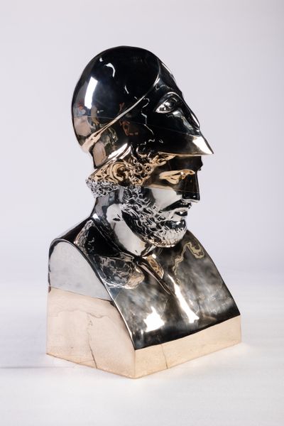 Daniel Arsham, Stratified Bust of Pericles (2023). Stainless steel, patinated bronze, polished bronze. 39 3/8 x 21 5/16 x 19 3/16 inch.