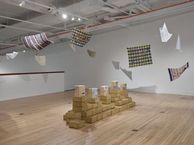 Areez Katki, Persepolitan (2022). Clay, straw, sand, pinewood, cotton thread, found textiles, natural pigments, oil pastel. 1,150 x 4,350 x 870 mm. Installation view of There Is No Other Home But This at the Govett-Brewster Art Gallery, New Plymouth NZ, 2022.