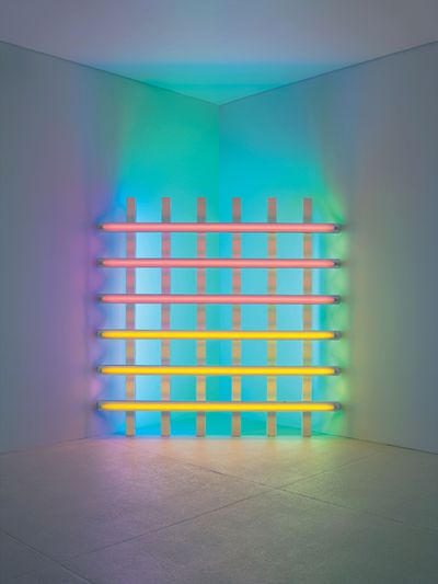 Dan Flavin, untitled (in honour of Harold Joachim) 3 (1977).__Pink, yellow, blue, and green fluorescent light, 8 ft. (244cm) square across a corner. The Dan Flavin Estate,