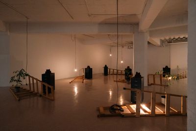 Lee James Ming-Hsueh, An Irrelevant Relationship (2024). Pepper, nutmeg, clove, cinnamon, salt, file cabinet, wooden ladder, litsea cubeba, electric wire, light bulb. Dimensions variable.