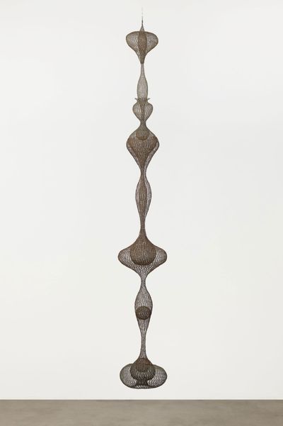 Ruth Asawa, Untitled (S.398, Hanging Eight-Lobed, Four-Part, Discontinuous Surface Form within a Form with Spheres in the Seventh and Eighth Lobes) (c. 1955). Brass wire, iron wire, and galvanized iron wire. 8′ 8 1/2″ × 14 1/2 × 14 1/2″ (265.4 × 36.8 × 36.8 cm). The Museum of Modern Art, Promised gift of Alice and Tom Tisch, 2016.