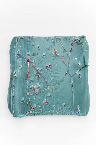 Yin Xiuzhen, Wall Instrument No. 28 (2019–2021). Porcelain, used clothes. 37-5/8 x 38-3/4 x 4-5/16 inches.