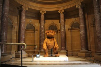 EJ Son, Dancing Teddy (2024). Synthetic fur, foam, buttons, perspex, steel, motor, steel, camera, monitor. 215 x 100 x 60 cm.