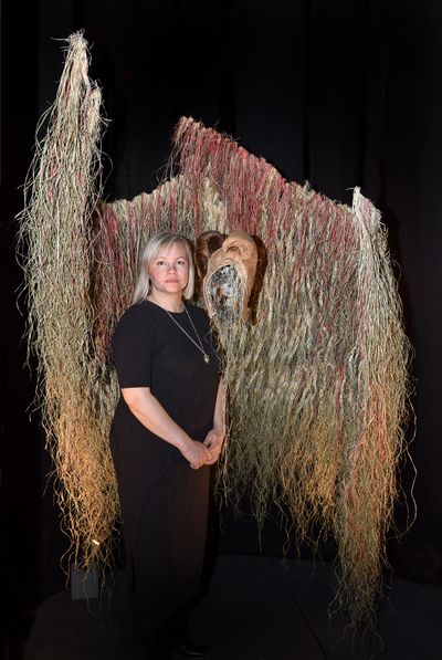 Máret Ánne Sara with her work, Suodji mis jus sajáidagáimet dovdat (We’ll have shelter for as long as we know our place) (2020). Exhibition view: Environmental Injustice – Indigenous Peoples’ Alternatives, Musée d’ethnographie de Genève, Geneva (24 September–21 August 2022).