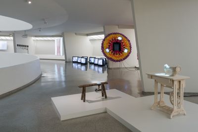 Lin Tianmiao, Sewing (1997). Sewing machine, table, cotton thread, colour video projection with sound. 30 sec. Take A Step Back Collection. Exhibition view: Art and China after 1989: Theater of the World, Solomon R. Guggenheim Museum, New York (6 October 2017–7 January 2018). © Solomon R. Guggenheim Foundation, 2017. Photo: David Heald.