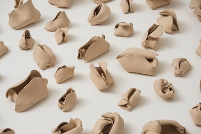 Hannah Wilke, ‘Untitled’ (1974–1977). Detail. Signed and dated. 103 terracotta sculptures 6.5 x 5.8 x 4.6 cm each; 2.5 x 152.4 x 152.4 cm board. © Marsie, Emanuelle, Damon and Andrew Scharlatt, Hannah Wilke Collection & Archive, Los Angeles. Licensed by VAGA, New York, NY/ DACS, London. Courtesy Alison Jacques Gallery, London and Hannah Wilke Collection and Archive, Los Angeles.