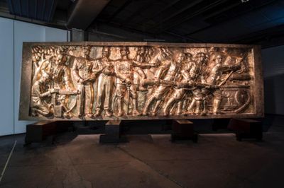 Arin Rungjang, 246247596248914102516... And then there were none (democracy monument) (2017). Wood and brass sculpture. Exhibition view: documenta 14, Neue Neue Galerie (Neue Hauptpost), Kassel (10 June–17 September 2017).