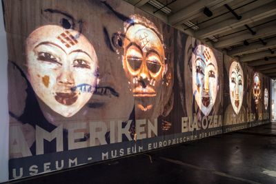 Theo Eshetu, Atlas Fractured (2017). Digital video projected on banner. Exhibition view: documenta 14, Neue Neue Galerie (Neue Hauptpost), Kassel (10 June–17 September 2017).