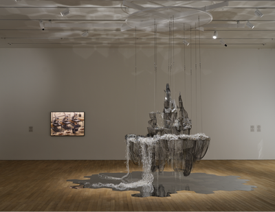 Left to right: Tetsuya Ishida, Interview (1998). Acrylic on board. 103 x 145.6 cm; Lee Bul, After Bruno Taut (Beware the sweetness of things) (2007). Crystal, glass, and acrylic beads on stainless-steel armature, aluminium and copper mesh, PVC, steel, and aluminium chains. 258 x 200 x 250 cm. Exhibition view: Phantom Plane, Cyberpunk in the Year of the Future, Tai Kwun Contemporary, Hong Kong (5 October 2019–4 January 2020). Courtesy the artists, Galerie Thaddaeus Ropac, and Tai Kwun Contemporary.