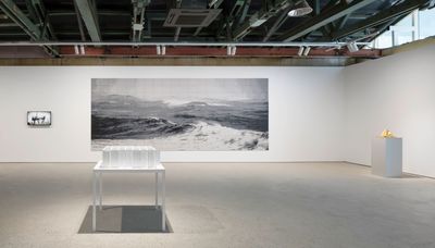An exhibition of artworks by Ahn Kyuchul in the gallery space. The most prominent work on view is a large rectangular image of a wave depicted in grey tones on the far wall.